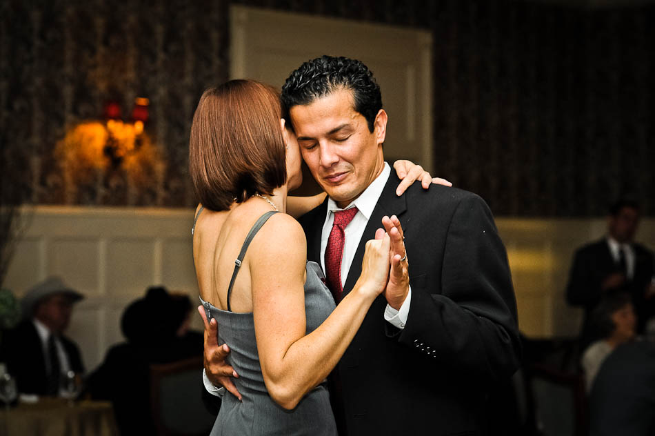 Married couple dances to a slow song at wedding reception in Austin, Texas