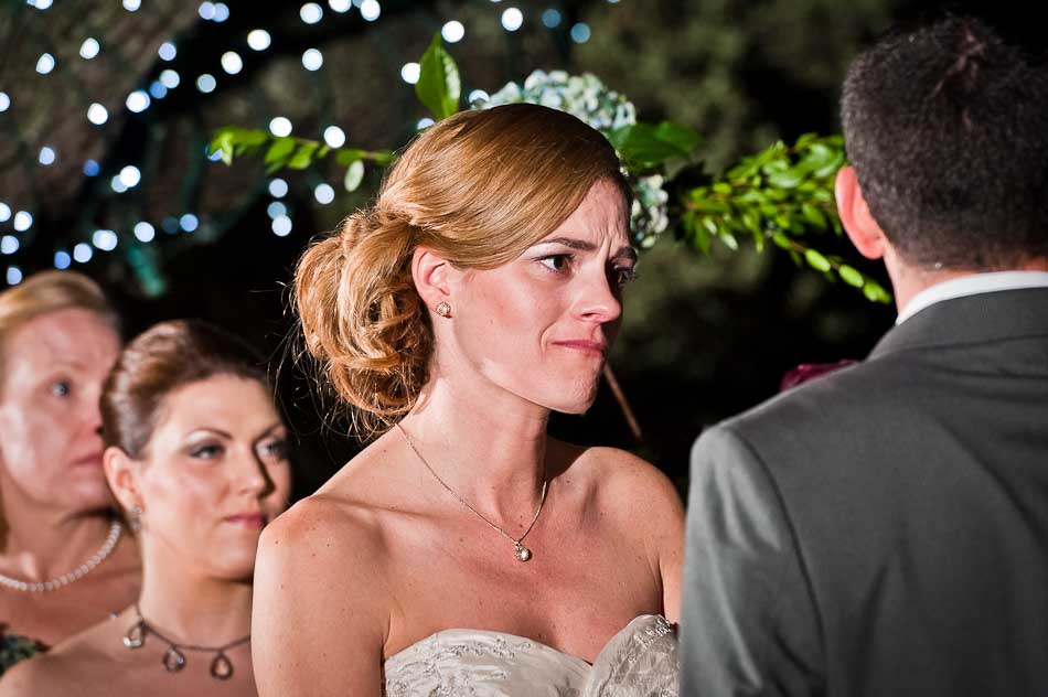 Bride lovingly looks at groom during ceremony