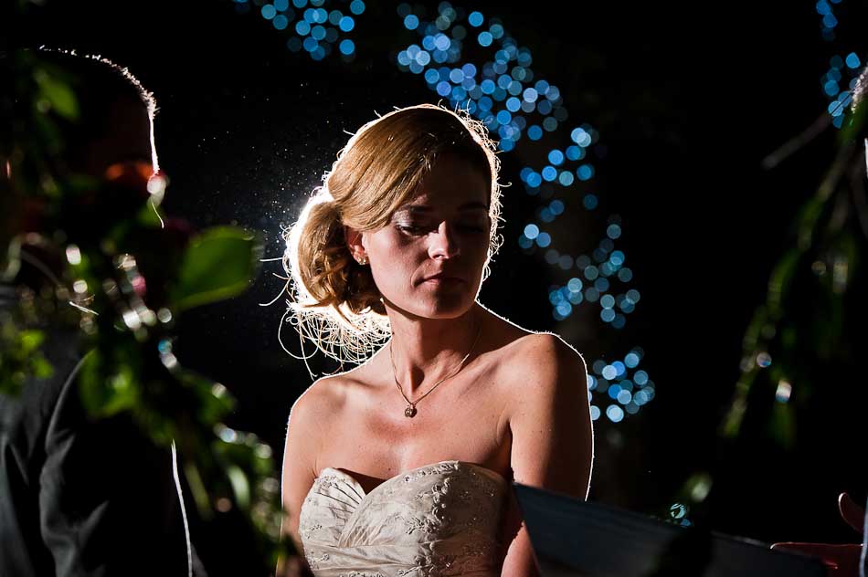 Dramatic portrait of bride during outside evening ceremony