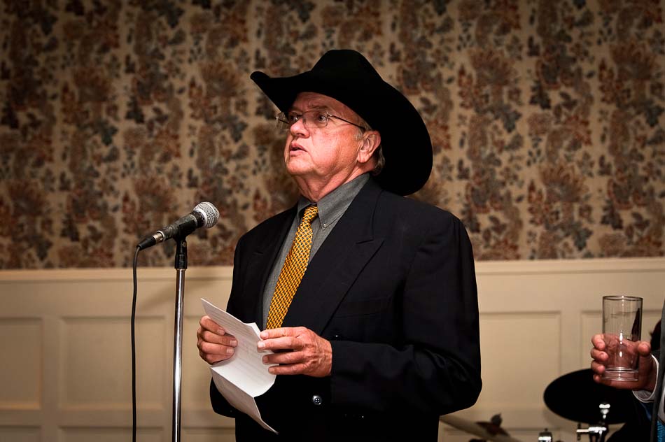 Father of the bride recites speech while wearing cowboy hat