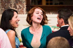 Wedding-guests-singing-laughing-photographer