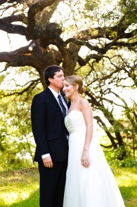 Groom-kissing-bride-under-trees-austin-texas