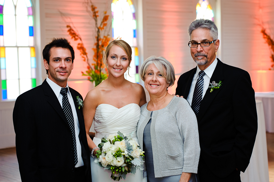 Bride with parents and brother during reception at mercury hall