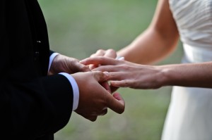 groom-putting-ring-bride-during-ceremony