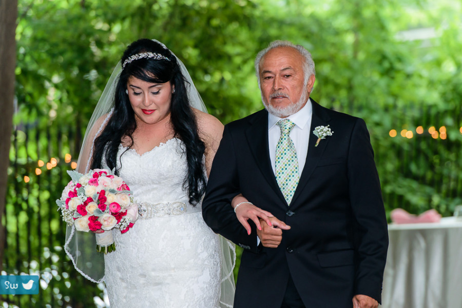 father walking daughter down aisle