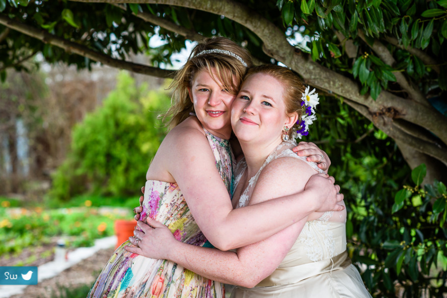 Bride with sister by Austin Wedding Photographer at Barr Mansion