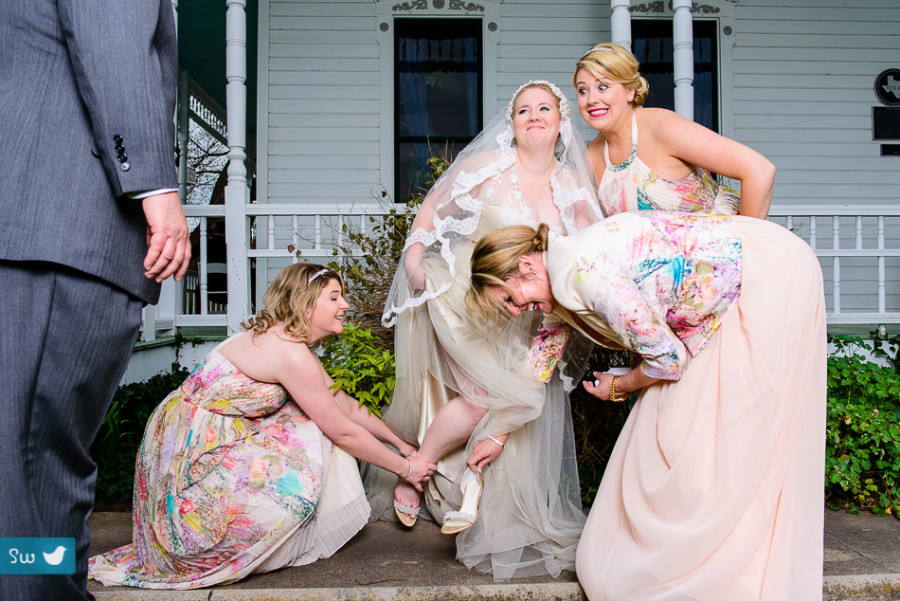 Funny getting ready moment by Austin Wedding Photographer at Barr Mansion