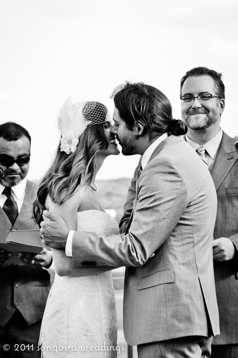 Austin Wedding Photographer - Ceremony kiss by the lake