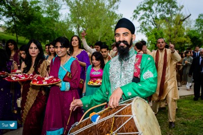 the Baraat, arrival of the Groom with the festivities and the Dhol (drum)