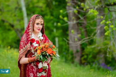 Bride wearing red sari during outdoor Indian Hindu ceremony at Lost Pines