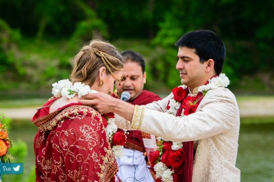 Exchange of garlands during Hindu Indian wedding ceremony at Lost Pines Resort