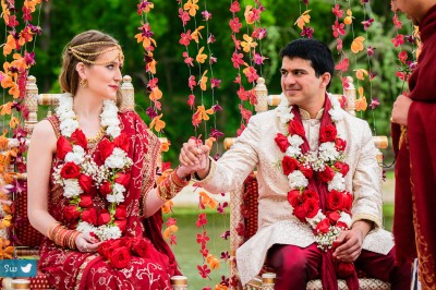 Bride and groom holding hands during Indian Hindu ceremony