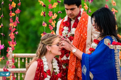 Mother of groom with bride during Hindu ceremony at Lost Pines