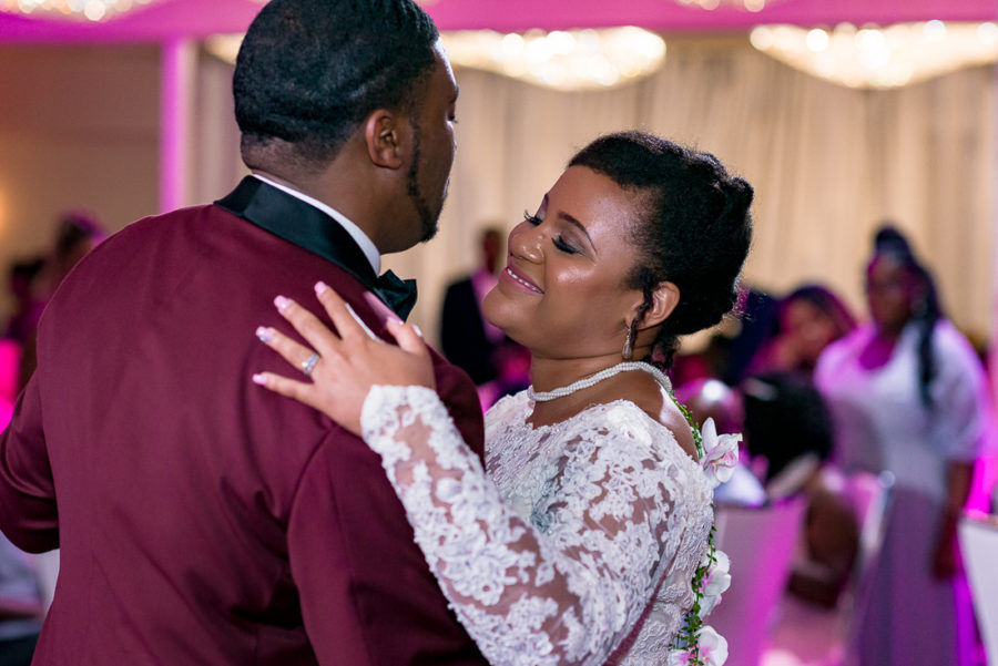 first dance with pink uplighting by austin wedding photographers