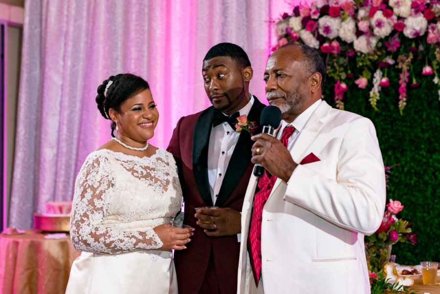 Father of black bride giving toast during reception by austin wedding photographers