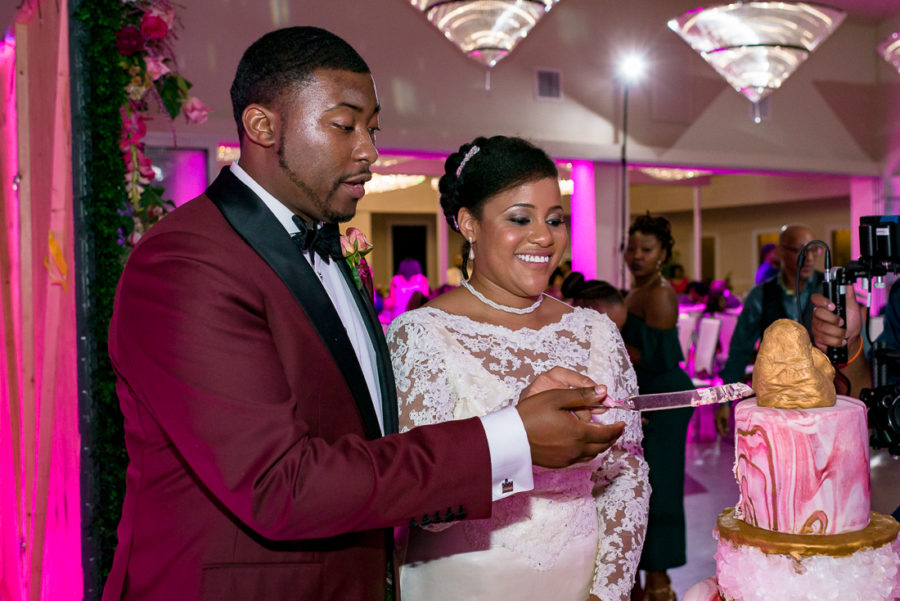 Geode Cake cutting pink and gold by austin wedding photographers