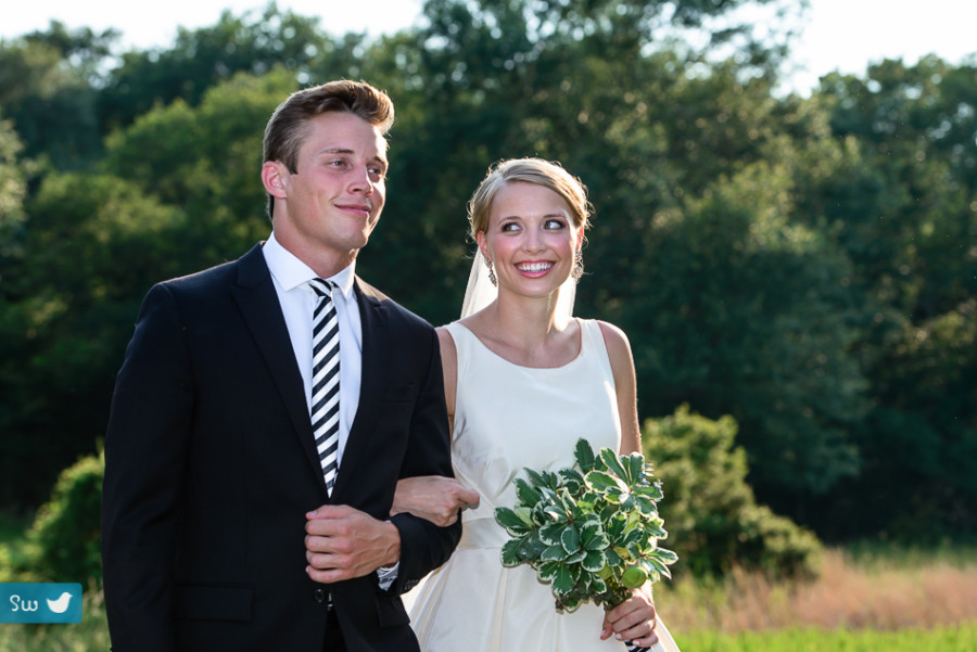 bride and brother walking to ceremony site