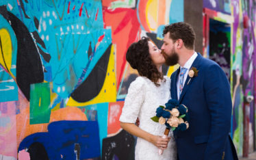 Austin-Wedding-Photographers-bride-downtown-mural-colorful-portrait