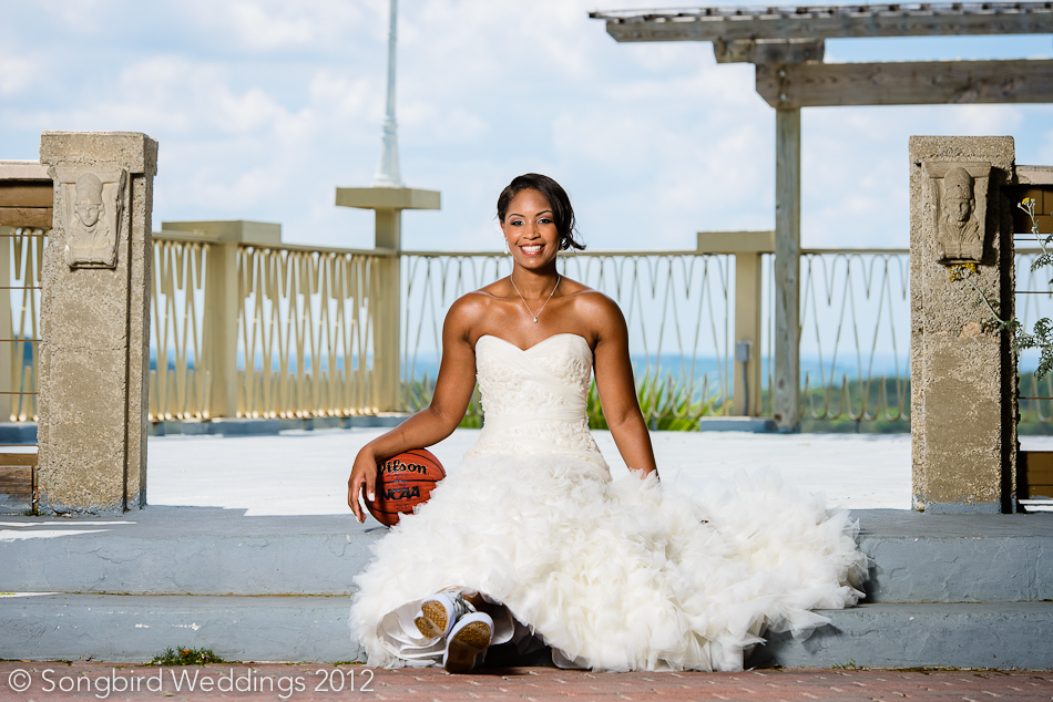 bride posing with basketball wearing converse at villa antonia wedding