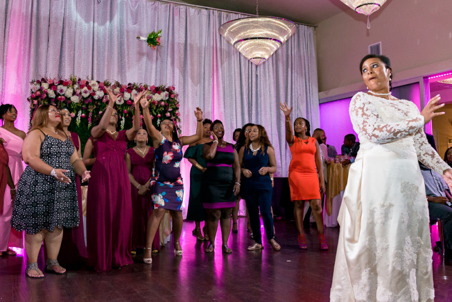 Bouquet toss with black bride by austin wedding photographers