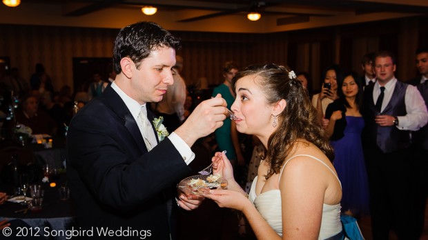 Groom-Feeding-Bride-Cake-Wedding