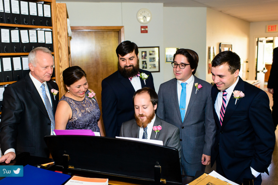 Groom and family playing the piano at Westlake Presbyterian church in Austin, Texas