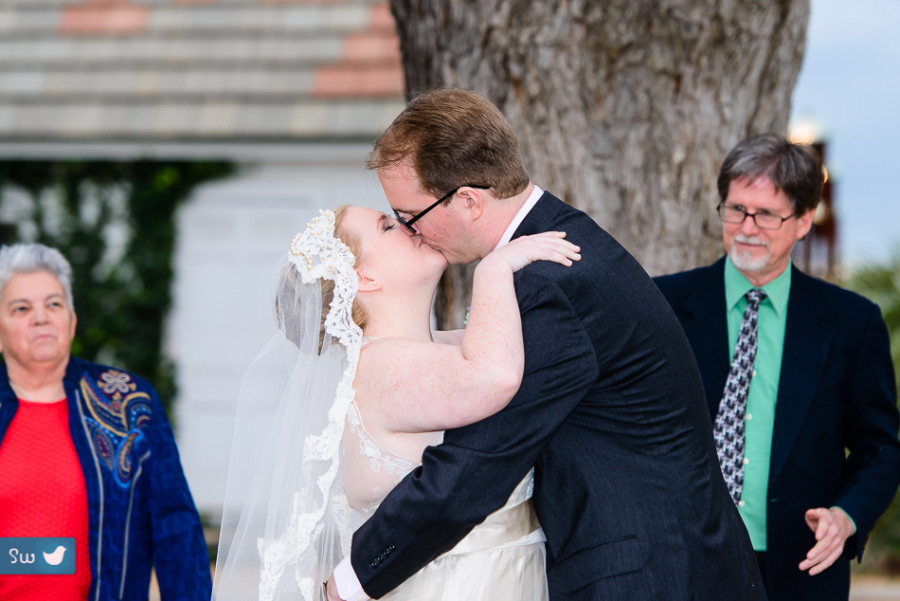 Ceremony kiss by Austin Wedding Photographer at Barr Mansion