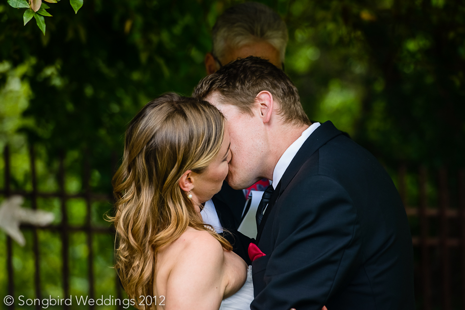 wedding ceremony kiss at zilker botanical gardens in austin, texas