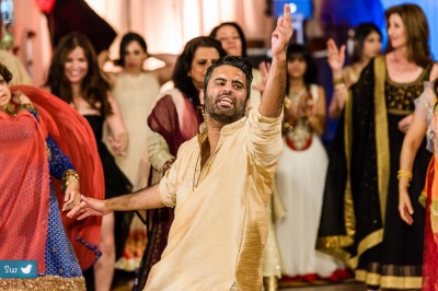 Indian wedding reception guest dancing at Hyatt Lost Pines