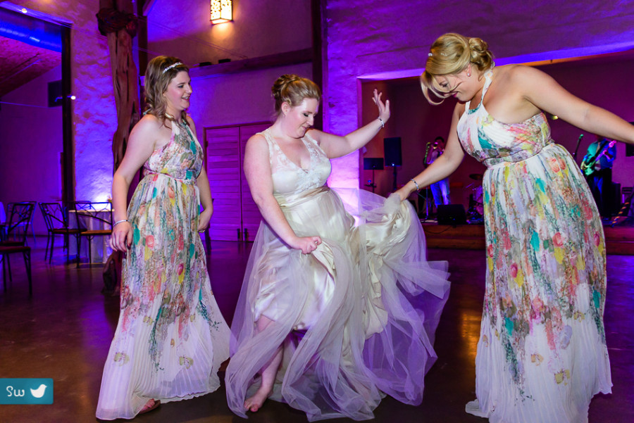 bridesmaids dancing by Austin Wedding Photographer at Barr Mansion