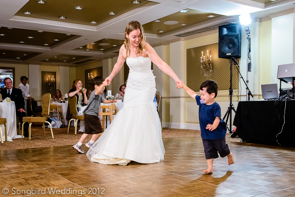 bride having fun with kids at Driskill Hotel wedding reception in Austin
