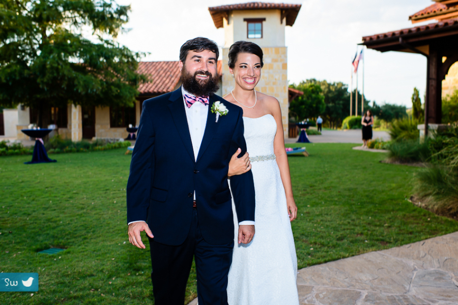 Wedding reception entrance of bride and groom at UT Golf Club by Austin Wedding Photographer