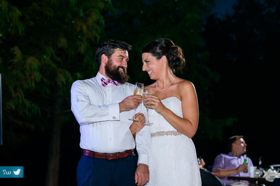 Bride and groom toast at UT Golf Club by Austin Wedding Photographer