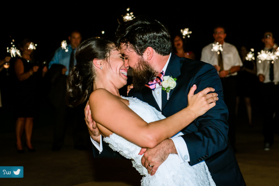 Sparkler exit pre-kiss with bride and groom at UT Golf Club by austin wedding photographer