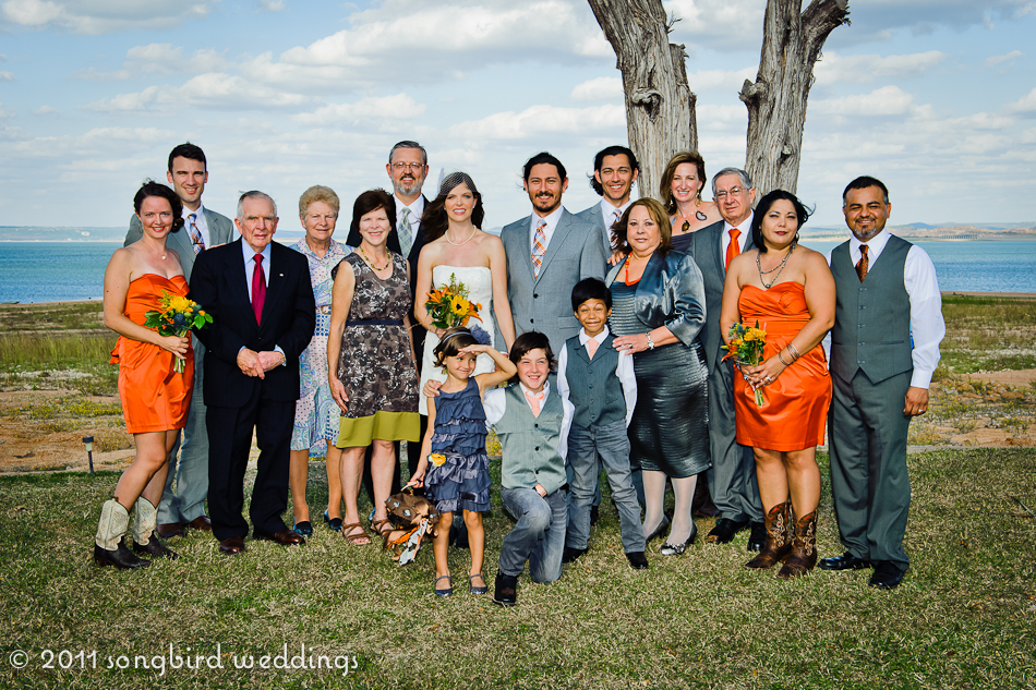 Wedding party formal family portrait by the lake