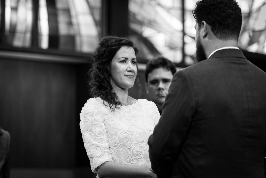 ceremony-Austin-Wedding-Photographers-dress-stained-glass-flowers-altar-central-presbyterian-church