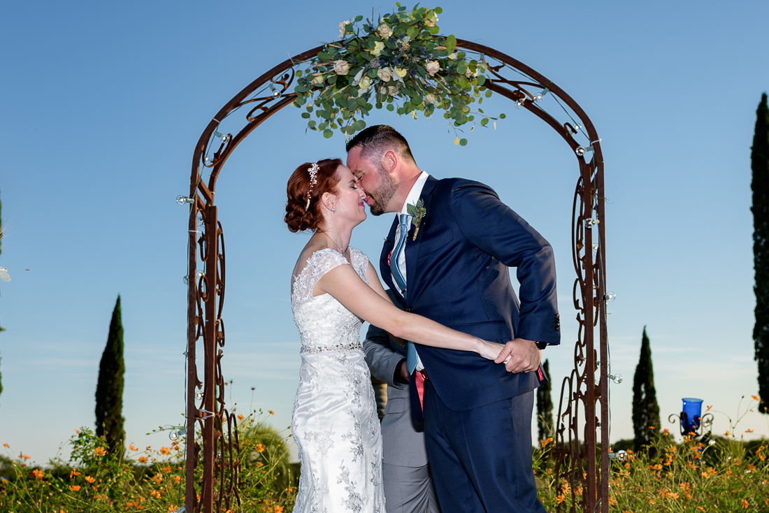 Austin wedding photographers outdoor ceremony trellis flowers texas le san michele