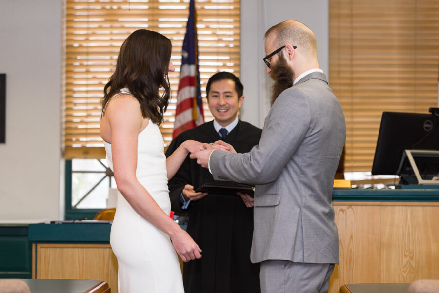 courthouse-groom-rings-tattooed-bride-Austin-wedding-photographers-Texas