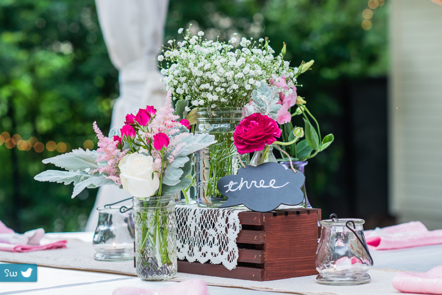 table setting with roses and signs