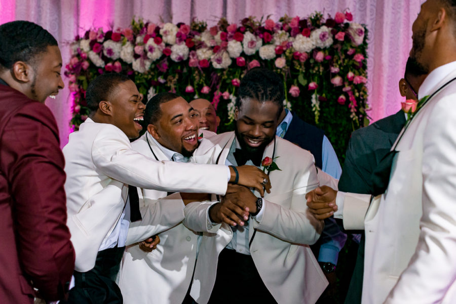 Black wedding party, garter toss by austin wedding photographers