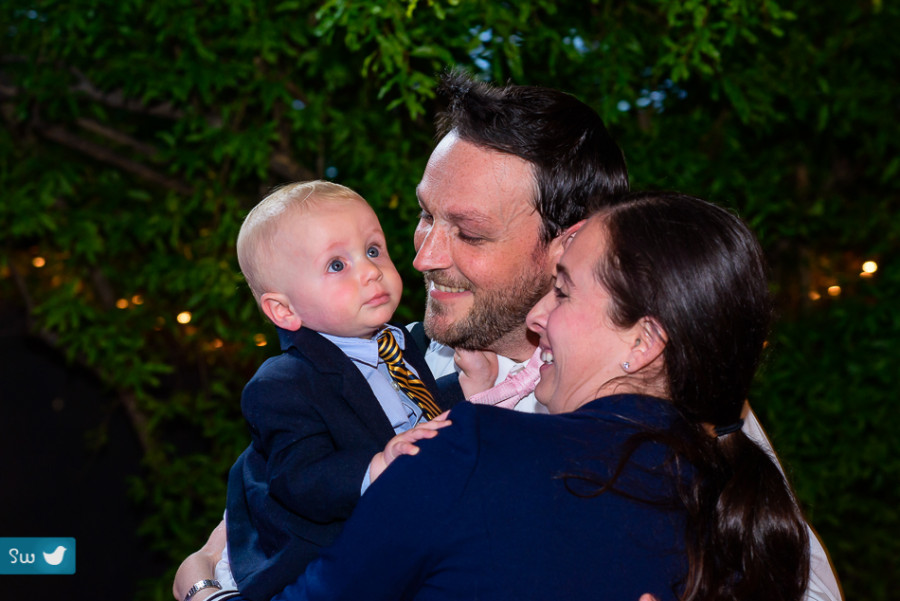 parent with baby at wedding