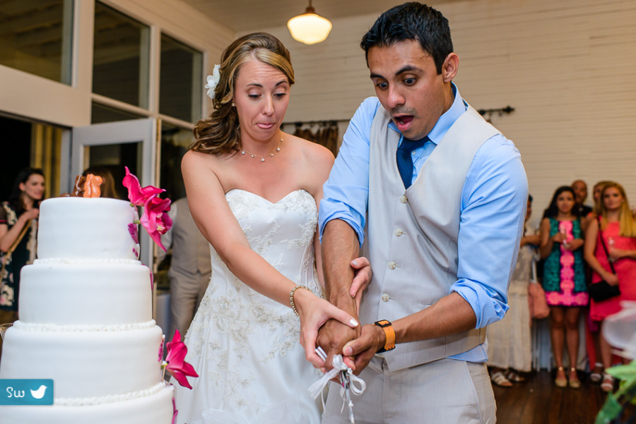 bride and groom cutting the mustache cake by austin wedding photographer