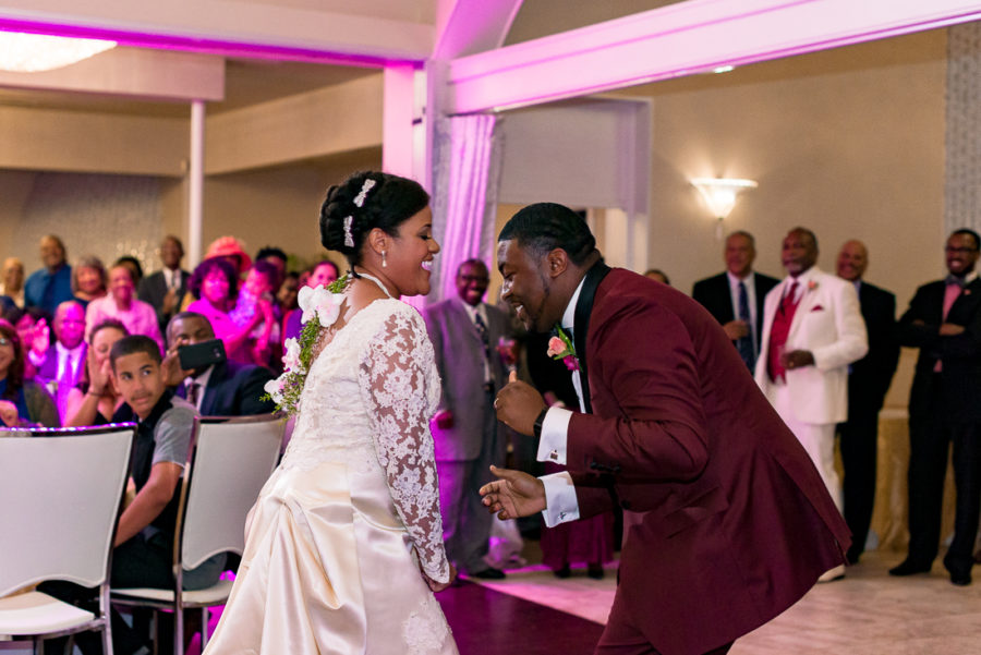 African American bride and groom dancing by austin wedding photographers