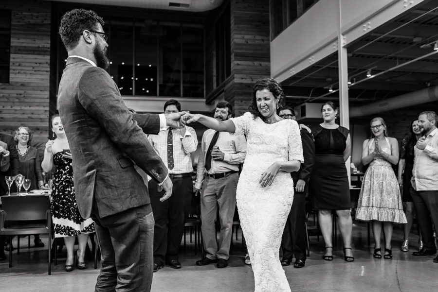 reception-Austin-Wedding-Photographers-bride-first-dance-bride-laughing-guests-texas-party