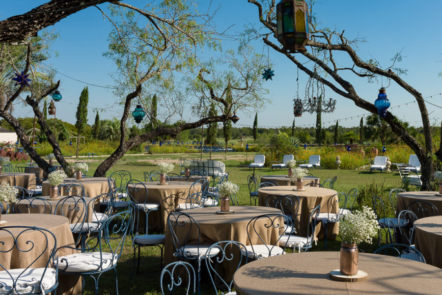 gold mason jars baby breath reception tables outdoor Le San Michele austin wedding photographers