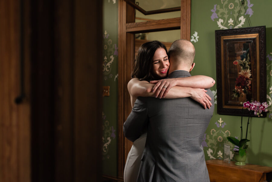 tx-barr-mansion-bride-groom-embrace-Austin-wedding-photographers