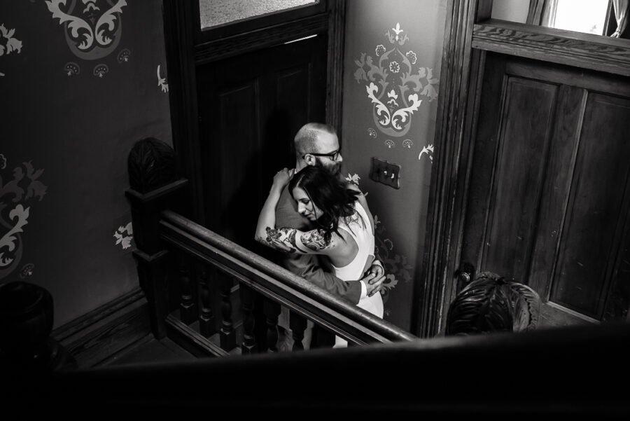 tx-barr-mansion-tattooed-bride-groom-hug-portrait-Austin-wedding-photographers